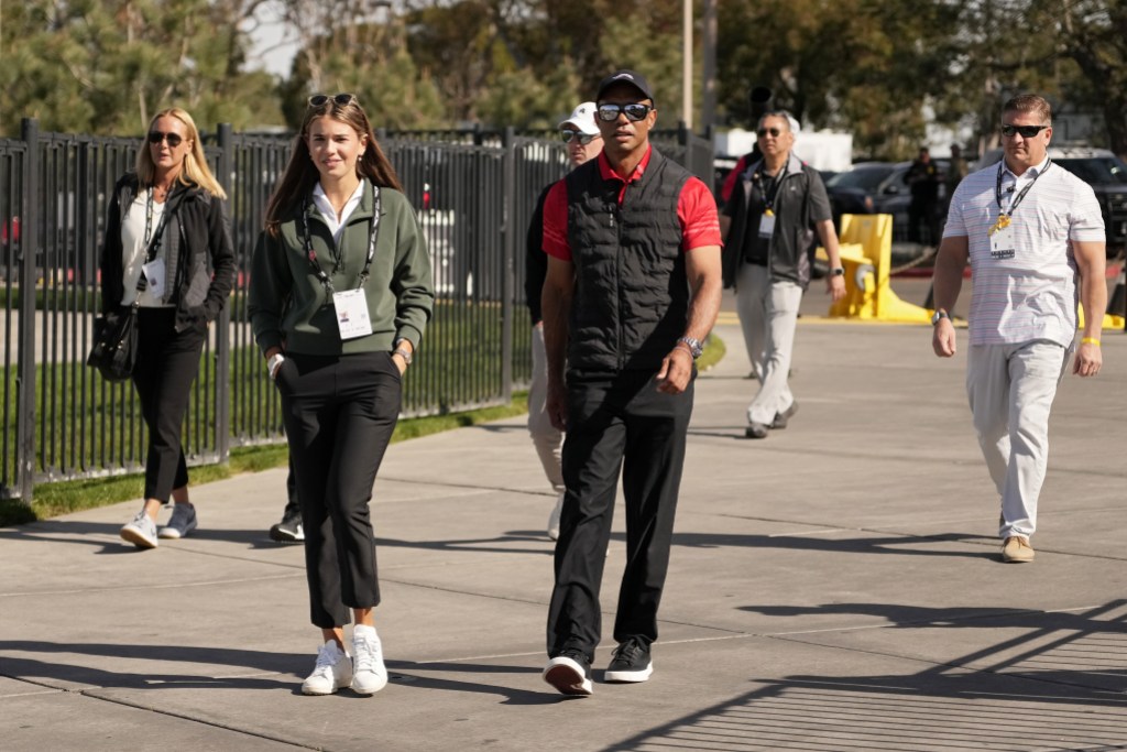 LA JOLLA, CALIFORNIA - FEBRUARY 16: Kai Trump (L) and Tiger Woods arrive to the course during the final round of The Genesis Invitational 2025 at Torrey Pines Golf Course on February 16, 2025 in La Jolla, California. (Photo by Michael Owens/Getty Images)