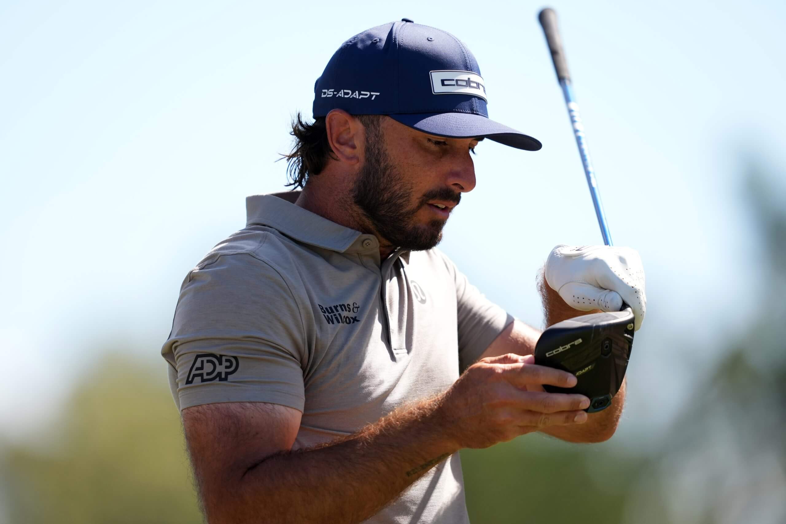 Max Homa studies the face of his driver during the Sanderson Farms Championship.