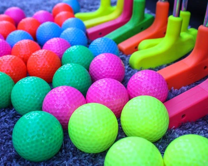 Glow-in-the-dark golfing equipment at Gloputt Mini Golf, one of the best mini golf courses in Auckland.