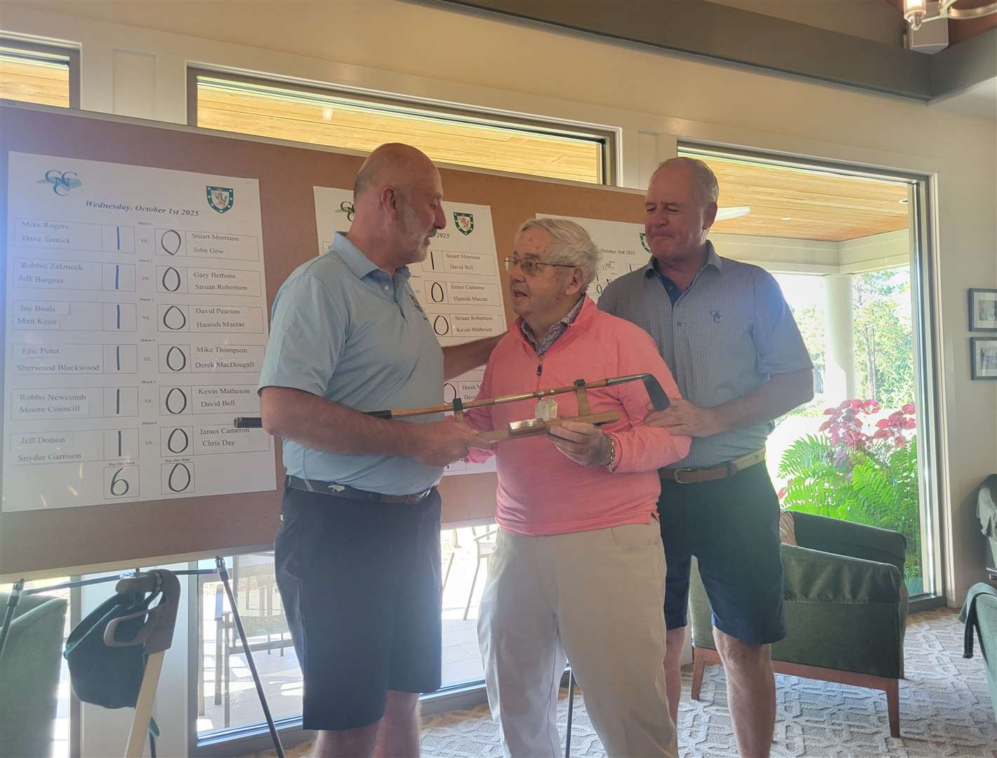 Captains present Roly Bluck to Ziggy Zalzneck.