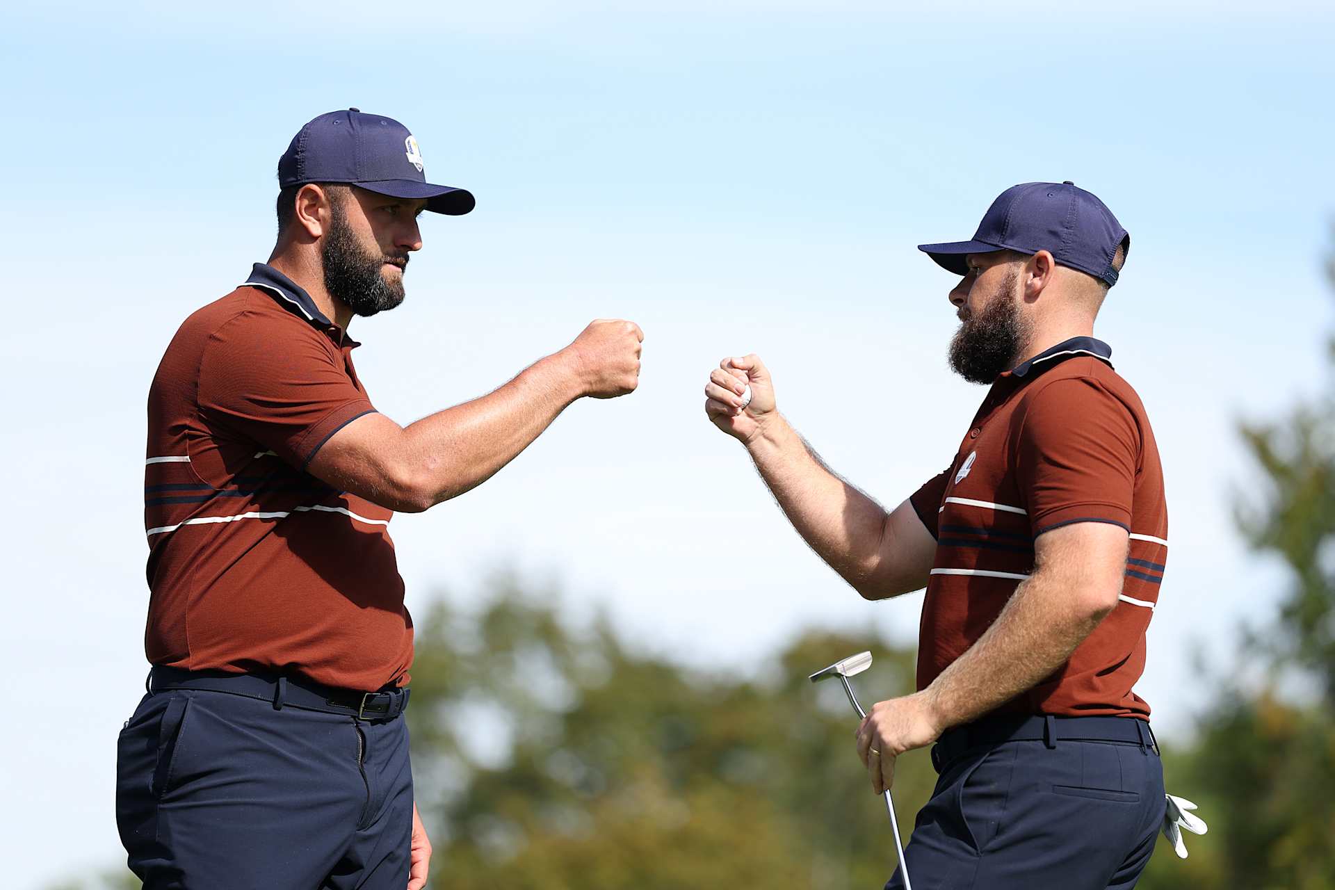 FARMINGDALE, NEW YORK - SEPTEMBER 27: (L-R) Jon Rahm and Tyrrell Hatton of Team Europe fist bump on the 14th green during the Saturday morning foursomes matches of the 2025 Ryder Cup at Black Course at Bethpage State Park Golf Course on September 27, 2025 in Farmingdale, New York. (Photo by Richard Heathcote/Getty Images)
