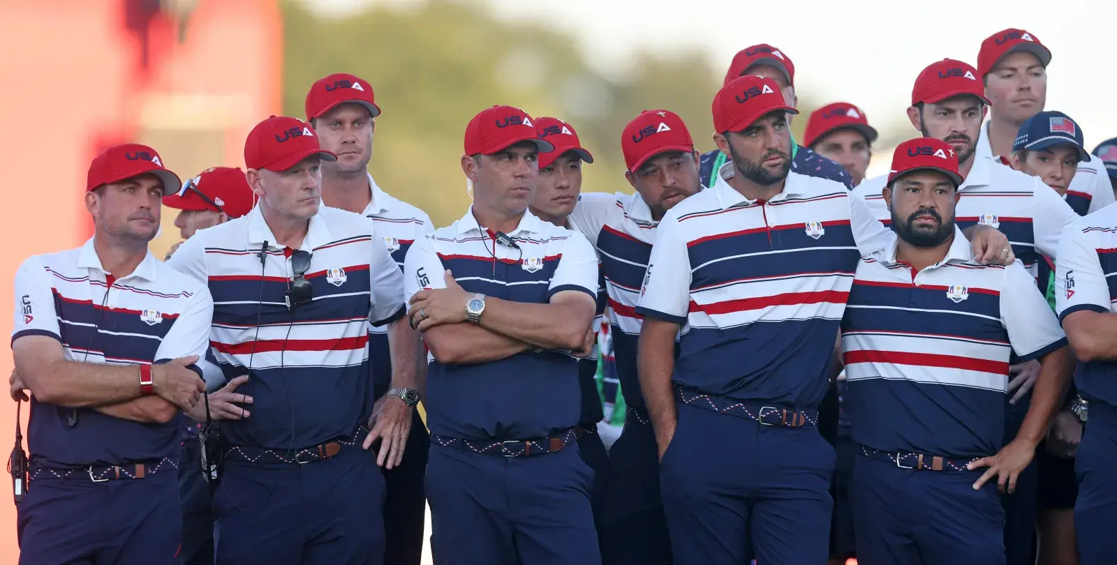FARMINGDALE, NEW YORK - SEPTEMBER 28: Captain Keegan Bradley and members of Team United States stand together on the 18th green after being defeated by Team Europe during the Sunday singles matches of the 2025 Ryder Cup at Black Course at Bethpage State Park Golf Course on September 28, 2025 in Farmingdale, New York.