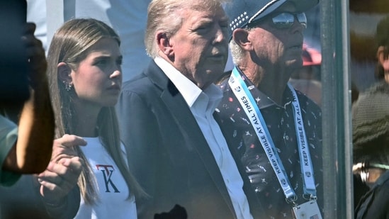 US President Donald Trump and his granddaughter Kai Trump attend the Ryder Cup golf tournament at Bethpage Black Golf Course in Farmingdale.(AP)