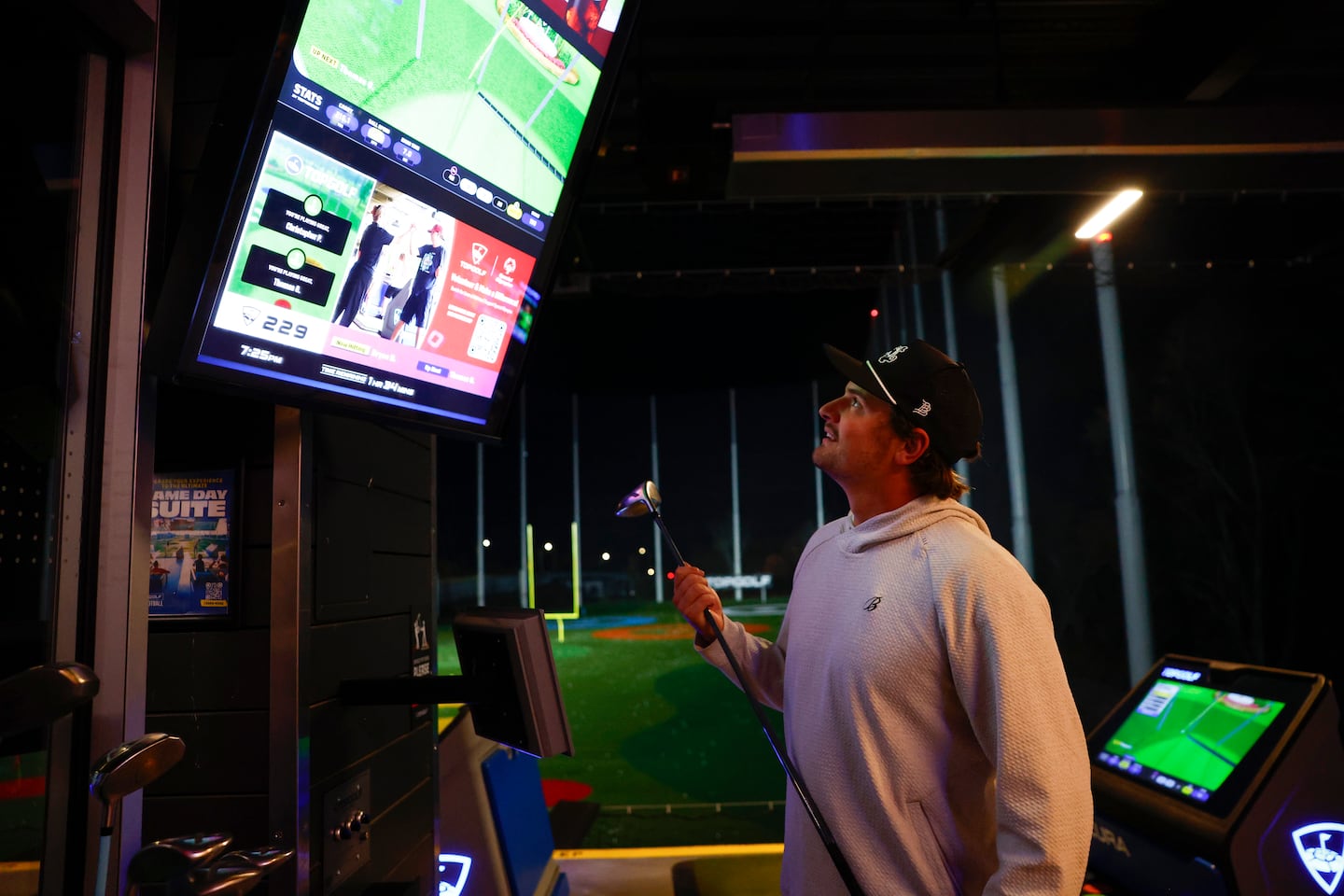 Patriots punter Bryce Barringer checked on his score at Topgolf in Canton.