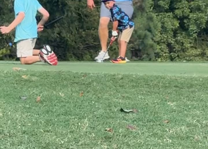 My 5 year old walking in a long birdie putt.