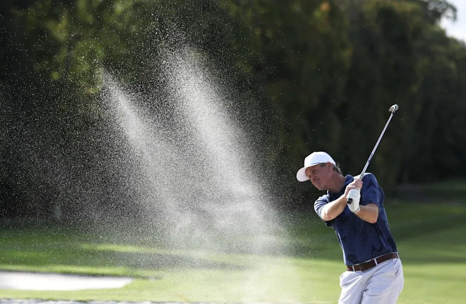 Head coach Jamie Lawlor hits from the bunker during practice for Cold Spring Harbor high school varsity golf at Huntington Country Club in Cold Spring Harbor. Heather Khalifa for New York Post