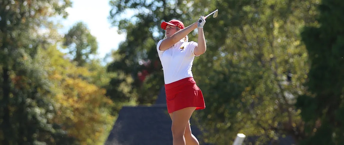 female golfer hitting the ball