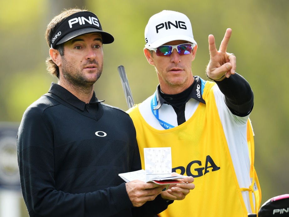 Bubba Watson and Ted Scott discussing the next shot
