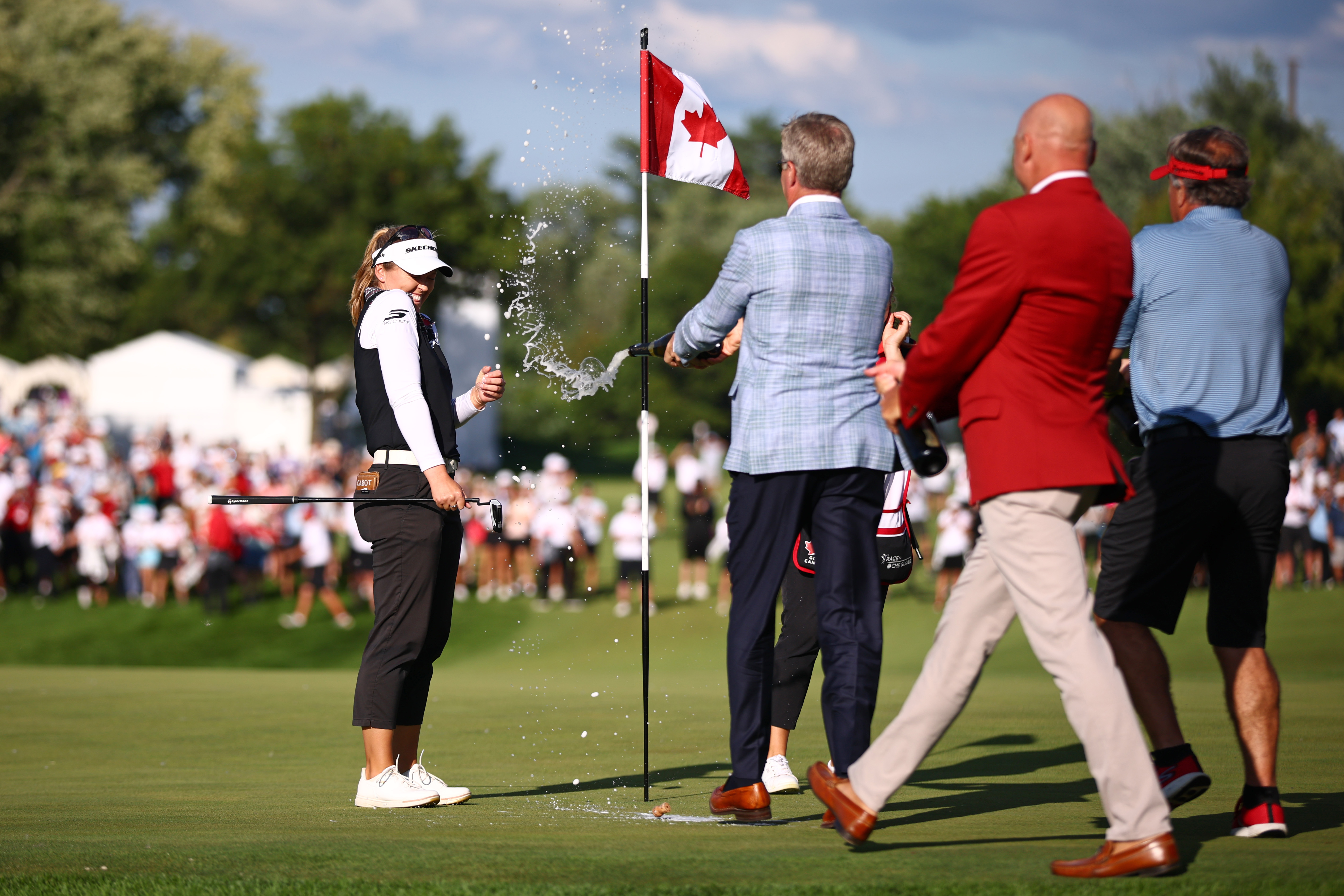 Brooke Henderson gets sprayed with champagne