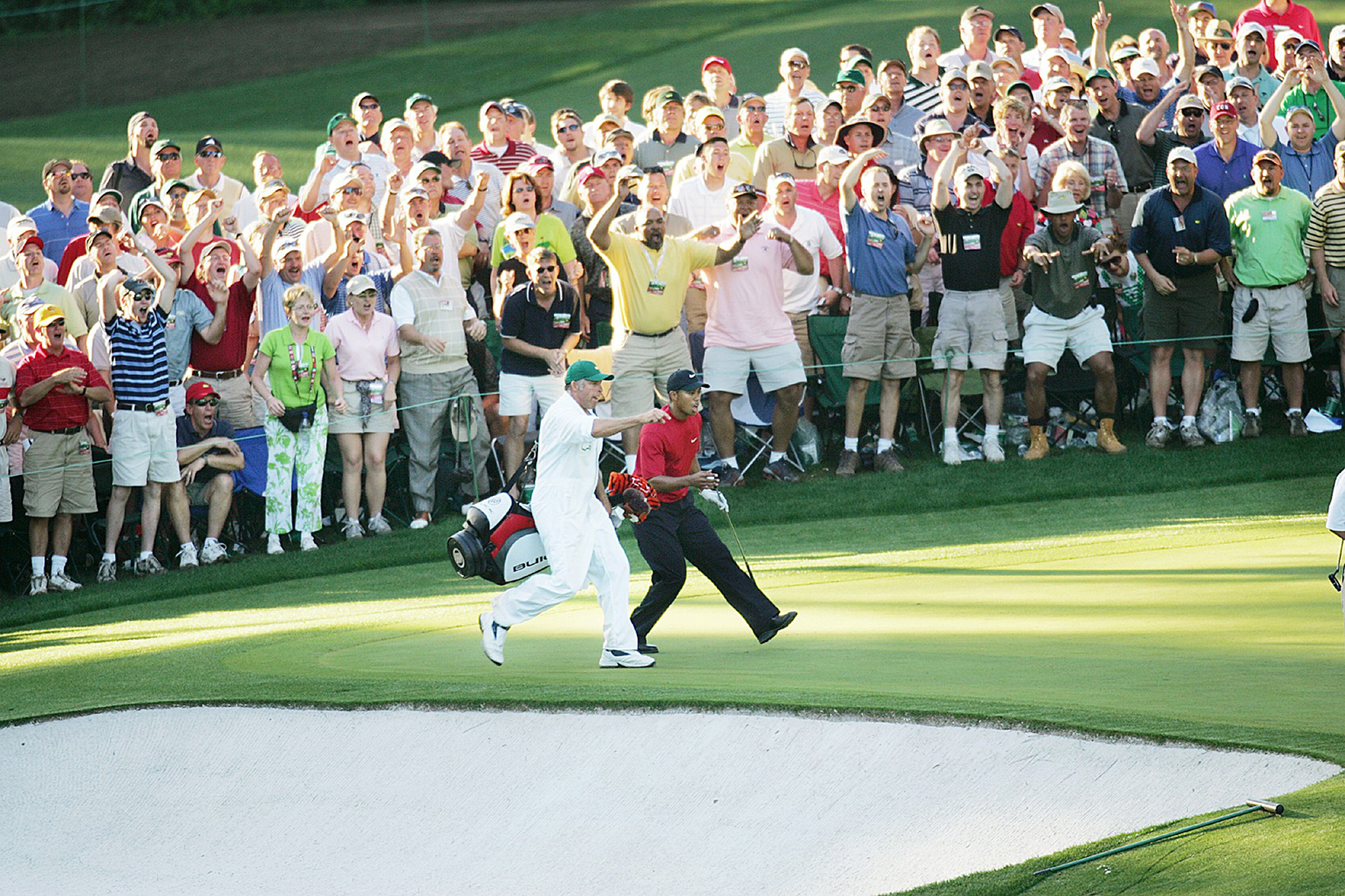Tiger Woods celebrating a chip in on the 16th green at The Masters in 2005
