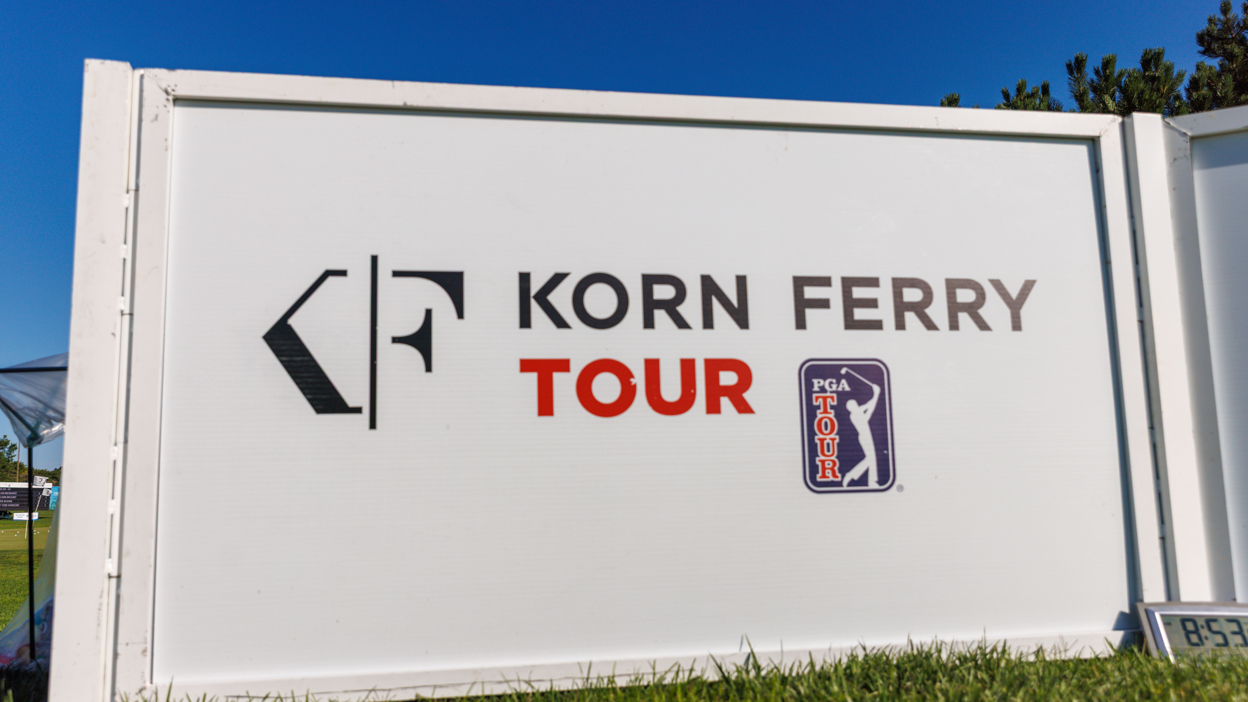 A Korn Ferry Tour logo on a board