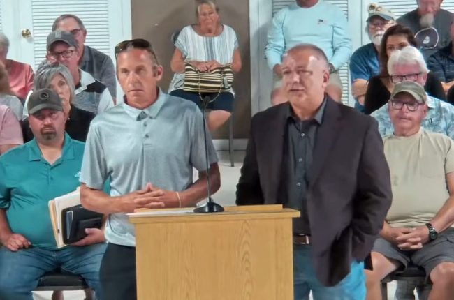 Jeff Ryan, eft, and T.J. Seoni before the City Commission Thursday evening. 