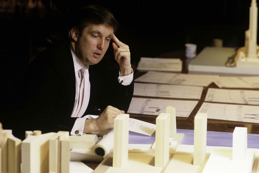 Donald Trump attends a board meeting to manage the construction of his buildings, in his New York offices in1987.