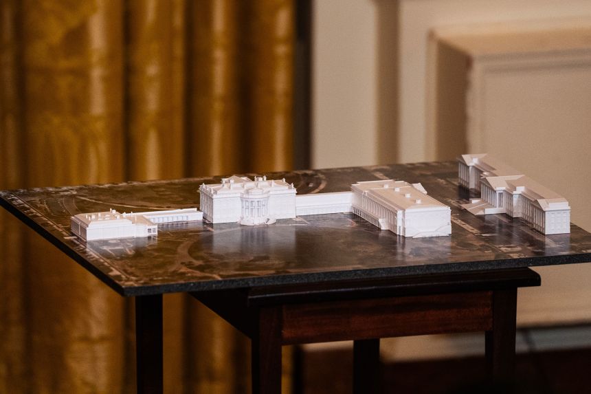 A model of the White House, including the planned ballroom addition, during a ballroom fundraising dinner in the East Room of the White House on October 15.