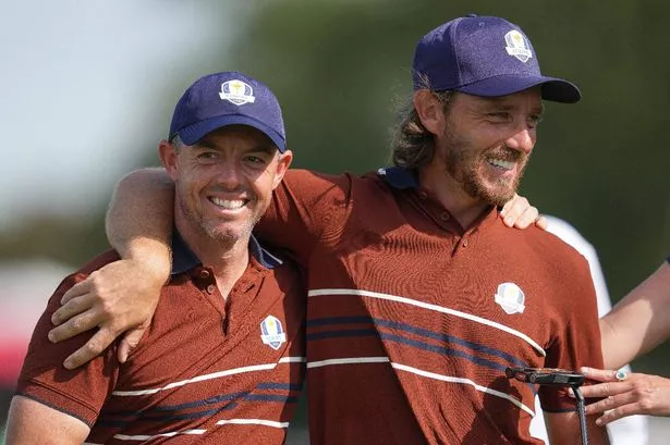 Rory McIlroy and Tommy Fleetwood of Team Europe