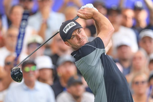 Laurie Canter of England plays his tee shot on the first hole during the third round of the DP World Tour Championship 
