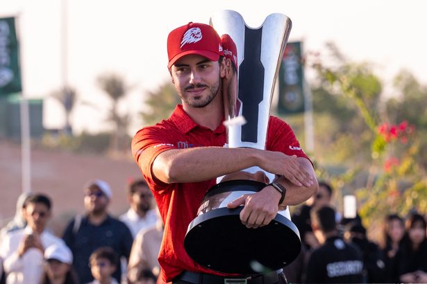 Josele Ballester holds the trophy from the Saudi International