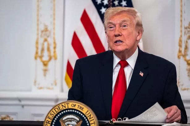 Donald Trump participates in a call with U.S. service members from his Mar-a-Lago club in Florida on Thanksgiving Day