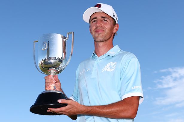 David Puig of Spain poses with the Joe Kirkwood Cup after victory on day four of the BMW Australian PGA Championship