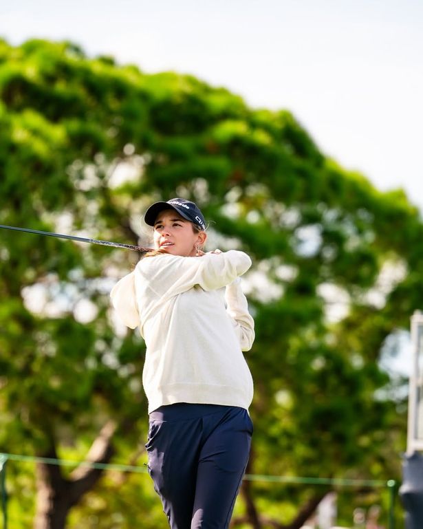 Trump swings her club during a practice round