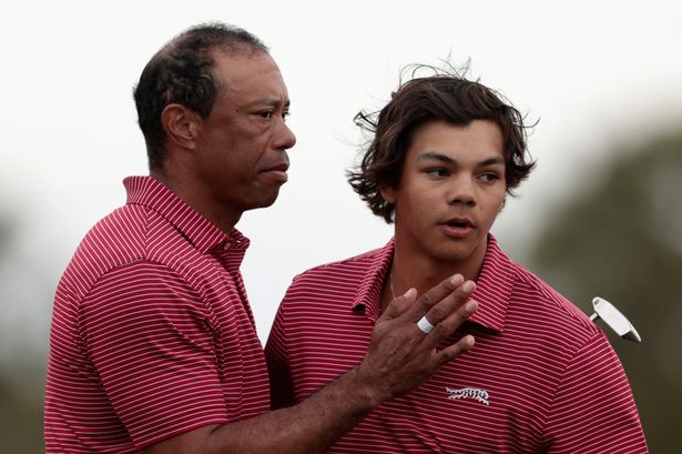 Tiger Woods of the United States and his son Charlie Woods react on the 18th green during the second round of the PNC Championship