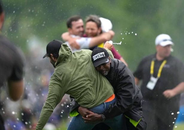 Adam Hadwin is tackled by security at the 2023 Canadian Open