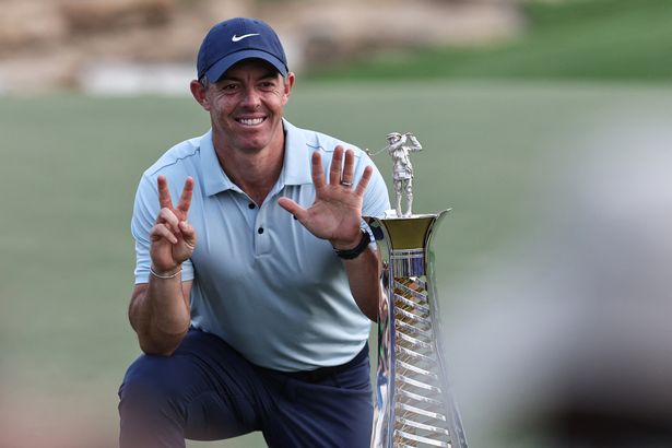 Rory McIlroy poses with his Race to Dubai crown