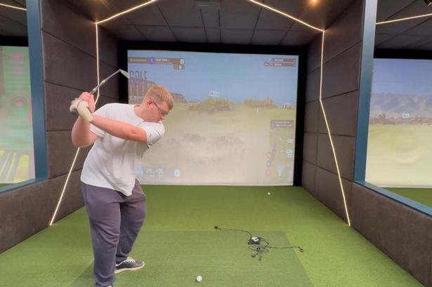 Reporter Oscar Fisher playing golf