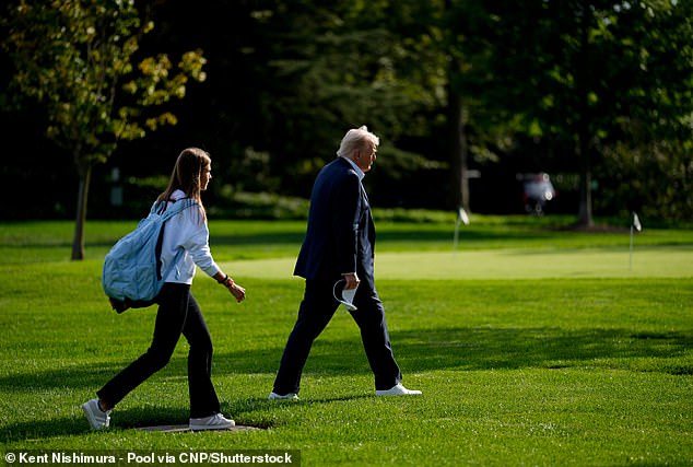 United States President Donald J Trump and his granddaughter Kai Trump walk to Marine One