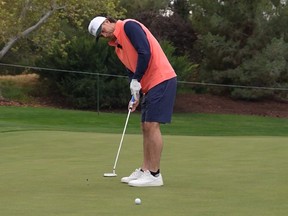 Toronto Blue Jays' Ernie Clement sinks a putt during the Capital One MLB Open at Shadow Creek.