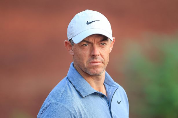 Rory McIlroy of Northern Ireland prepares to play a shot 