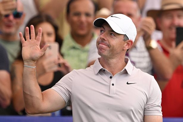 Rory McIlroy of Northern Ireland acknowledges the crowd on the first tee on day three of the DP World Tour Championship
