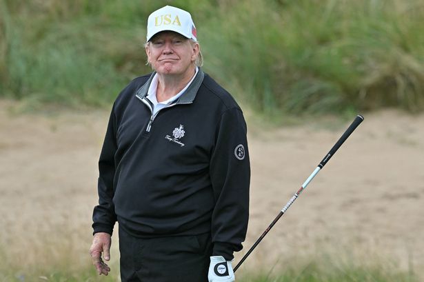 US President Donald Trump reacts after playing from the first tee to officially open the Trump International Golf Links course in Balmedie, Aberdeenshire, north east Scotland on July 29, 2025.