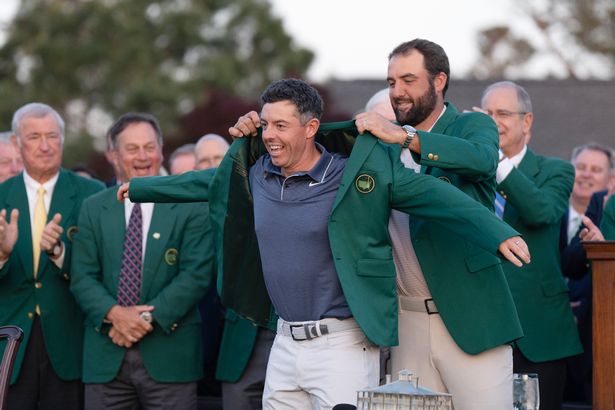 Rory McIlroy receives a Green Jacket after winning The Masters