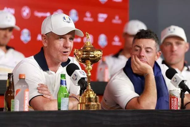 Luke Donald and Rory McIlroy after Team  Europe clinched Ryder Cup success in New York