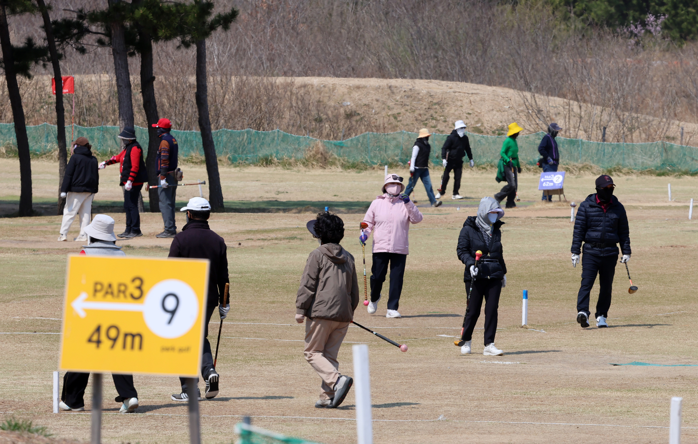 People play park golf at a field in Gangwon on April 3. [YONHAP]