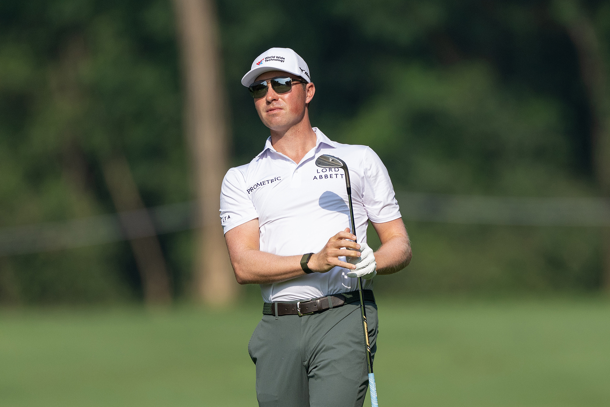 Ben Griffin watching the golf ball in flight after hitting a wedge shot