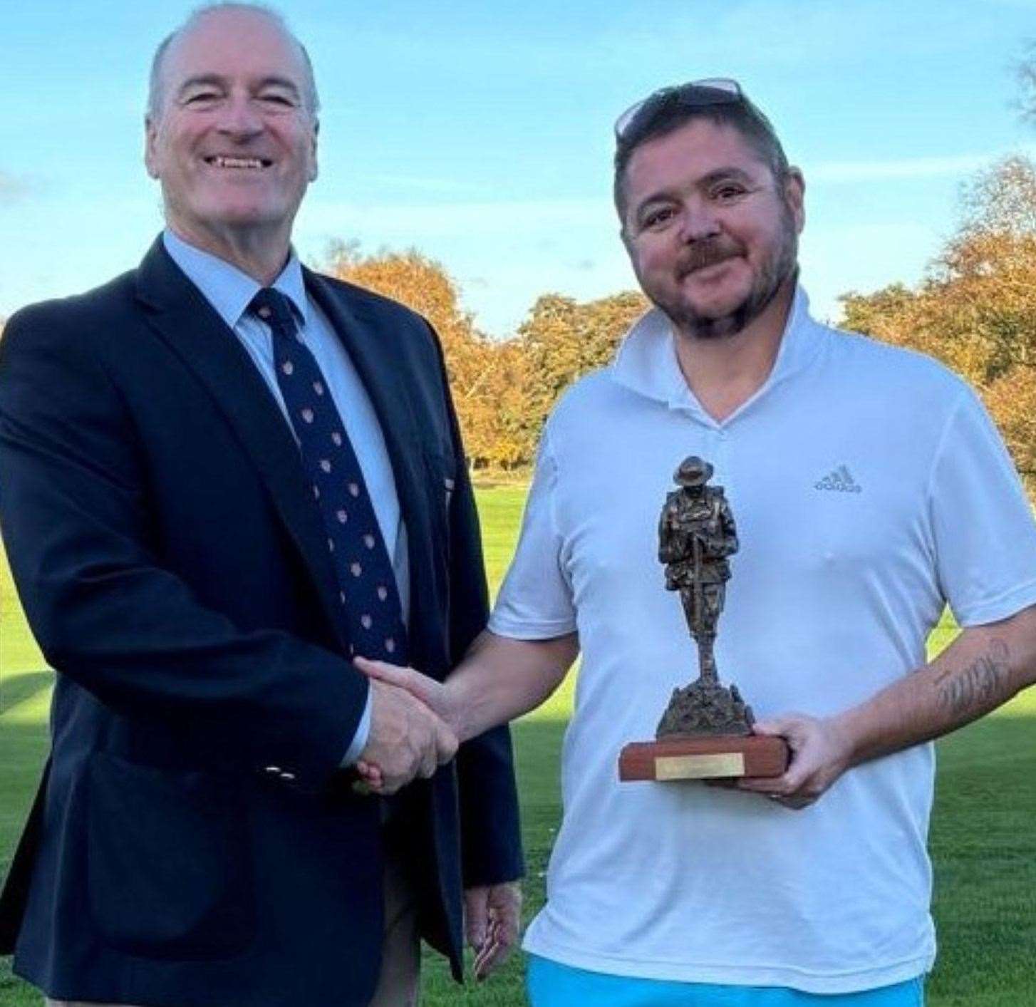 Canterbury Golf Club’s David Forrester (right) receives the Haig Medal Trophy from captain Nigel Hylands
