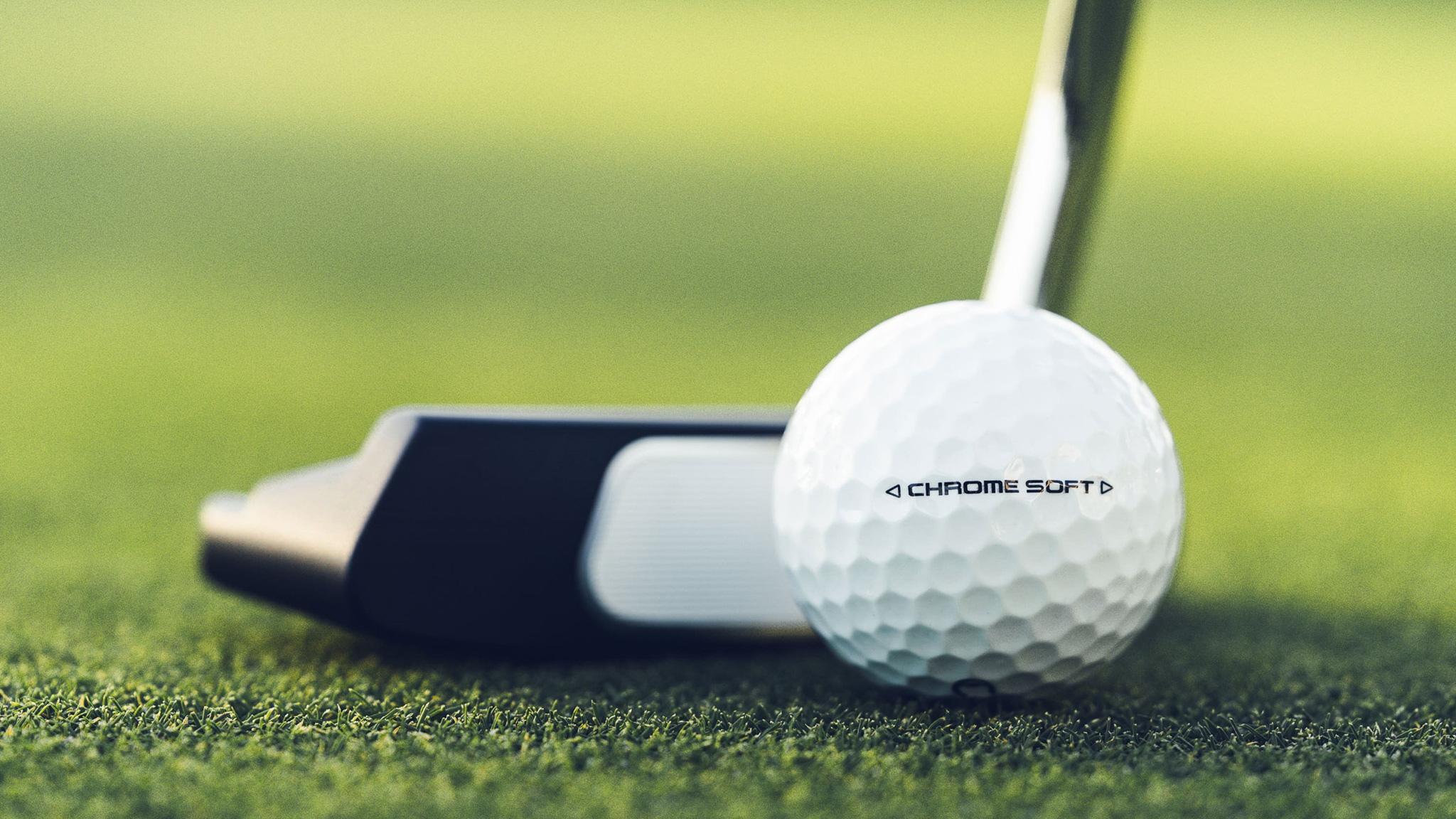 Close-up details of the Callaway Chrome Soft golf ball with putter