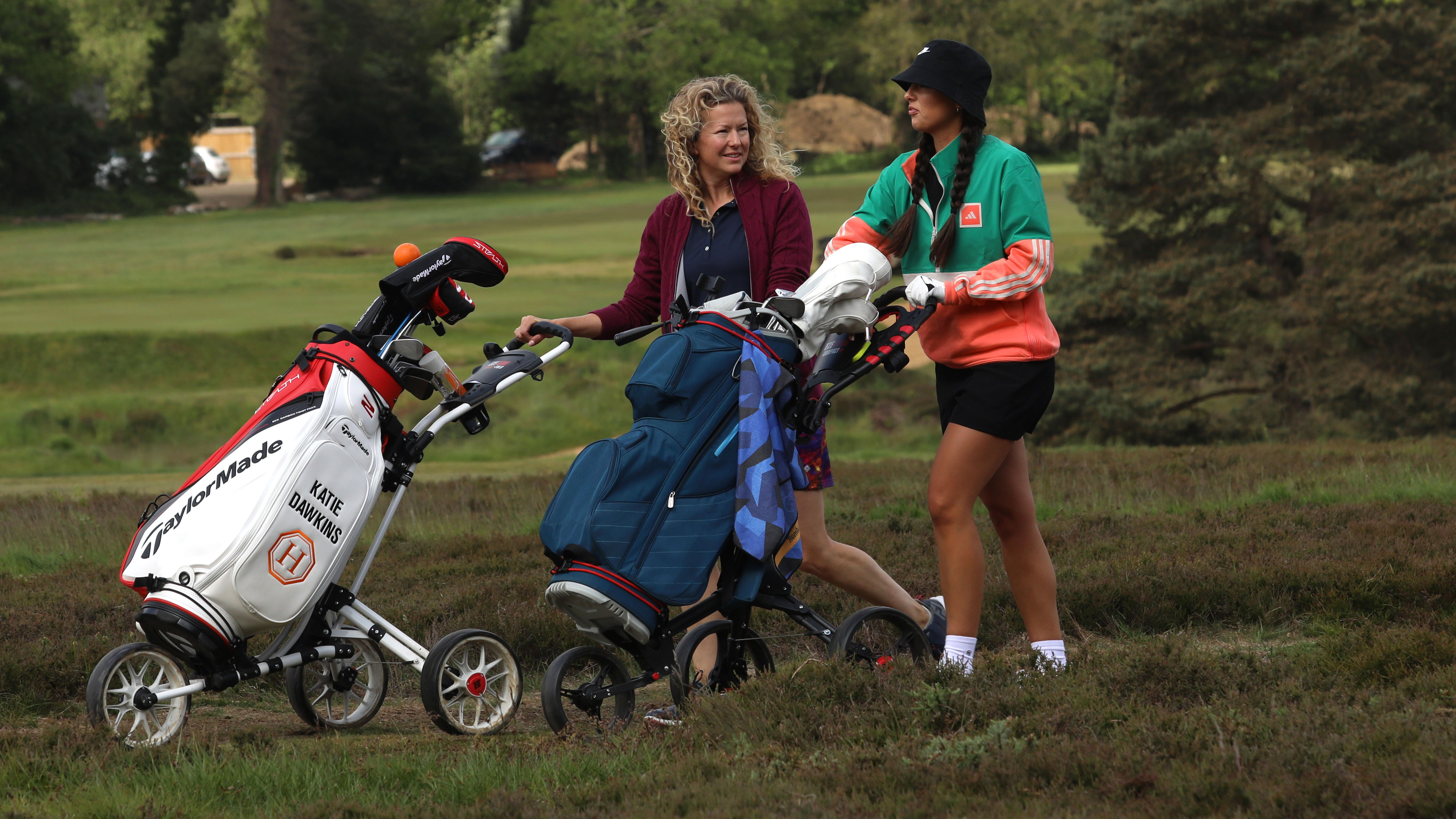 Two women playing golf together