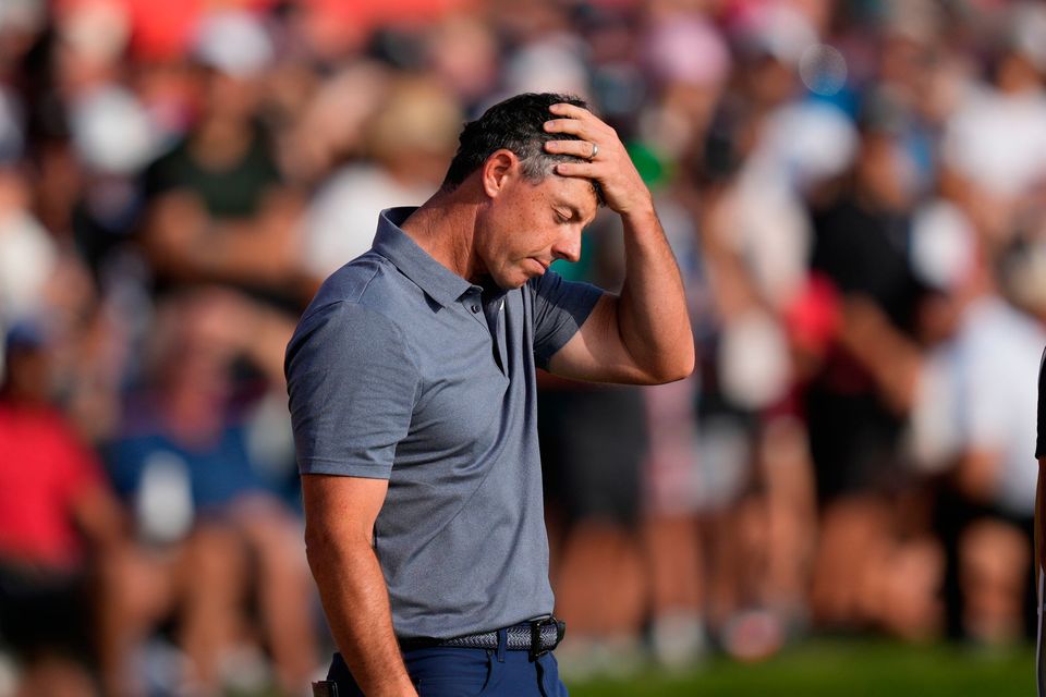 Rory McIlroy reacts at the 18th hole during the final round of the Abu Dhabi Golf Championship in Abu Dhabi, United Arab Emirates. (AP Photo/Altaf Qadri)