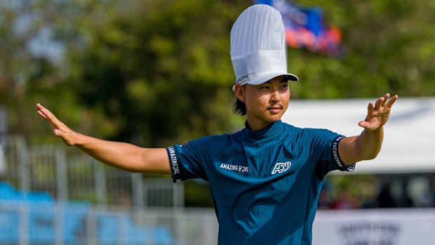 Min Woo Lee celebrates his 2023 Australian PGA Championship win on the 17th green, donning a chef's hat and engaging with the roaring crowd.