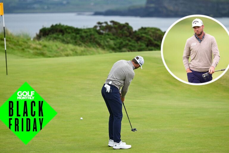 Sam Burns hits a putt and walks off the green