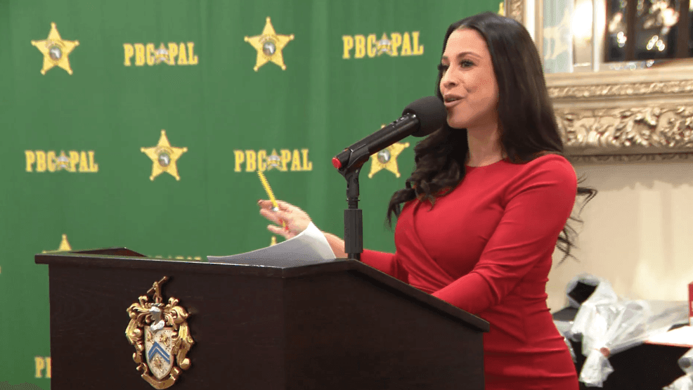 CBS12's Luli Ortiz presents awards during the PBSO-PAL awards ceremony, celebrating 20 years of youth programs. (WPEC)