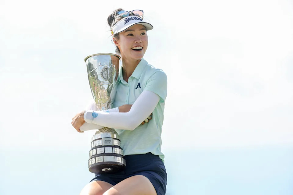 Australia's Grace Kim holds the trophy after her victory on the first playoff hole after the final round of the Amundi Evian Championship at Evian Resort Golf Club, in Evian-Les-Bains, eastern France on July 13, 2025.