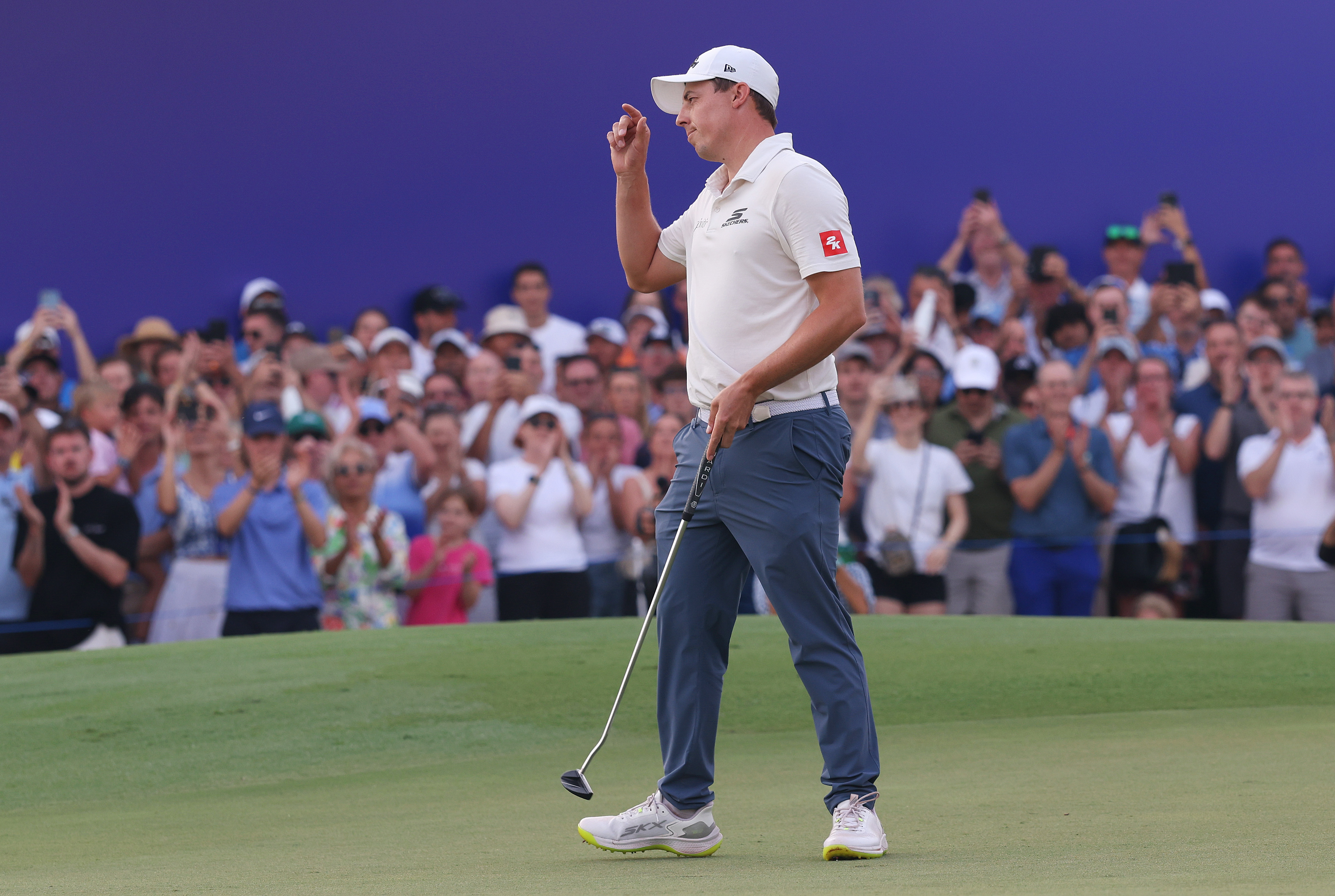 Matt Fitzpatrick reacts after a holed putt