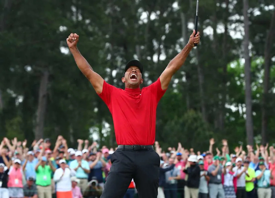 Tiger Woods celebrates after making a putt on the 18th green to win the Masters Tournament at Augusta National Golf Club on April 14, 2019. Rob Schumacher / USA TODAY NETWORK via Imagn Images