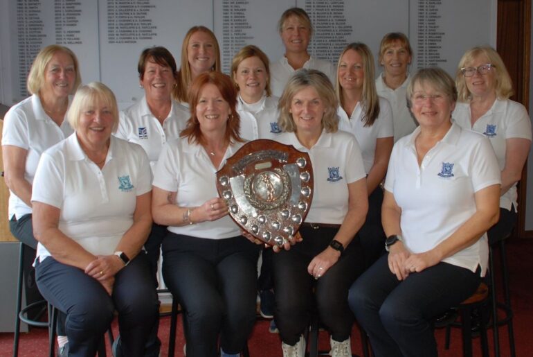 Shropshire Ladies County Golf Association (SLCGA) president Margaret Ratcliffe presents the Wynne Corrie Cup Caroline Sycamore