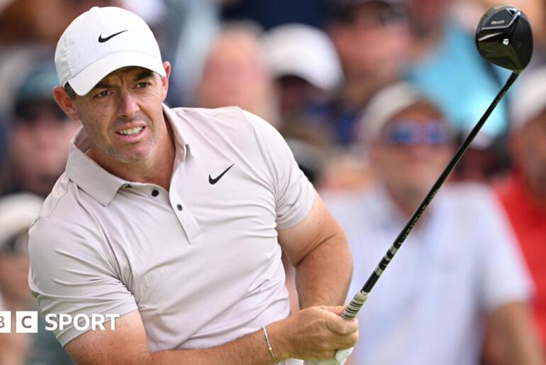 Rory McIlroy watches one of his shots