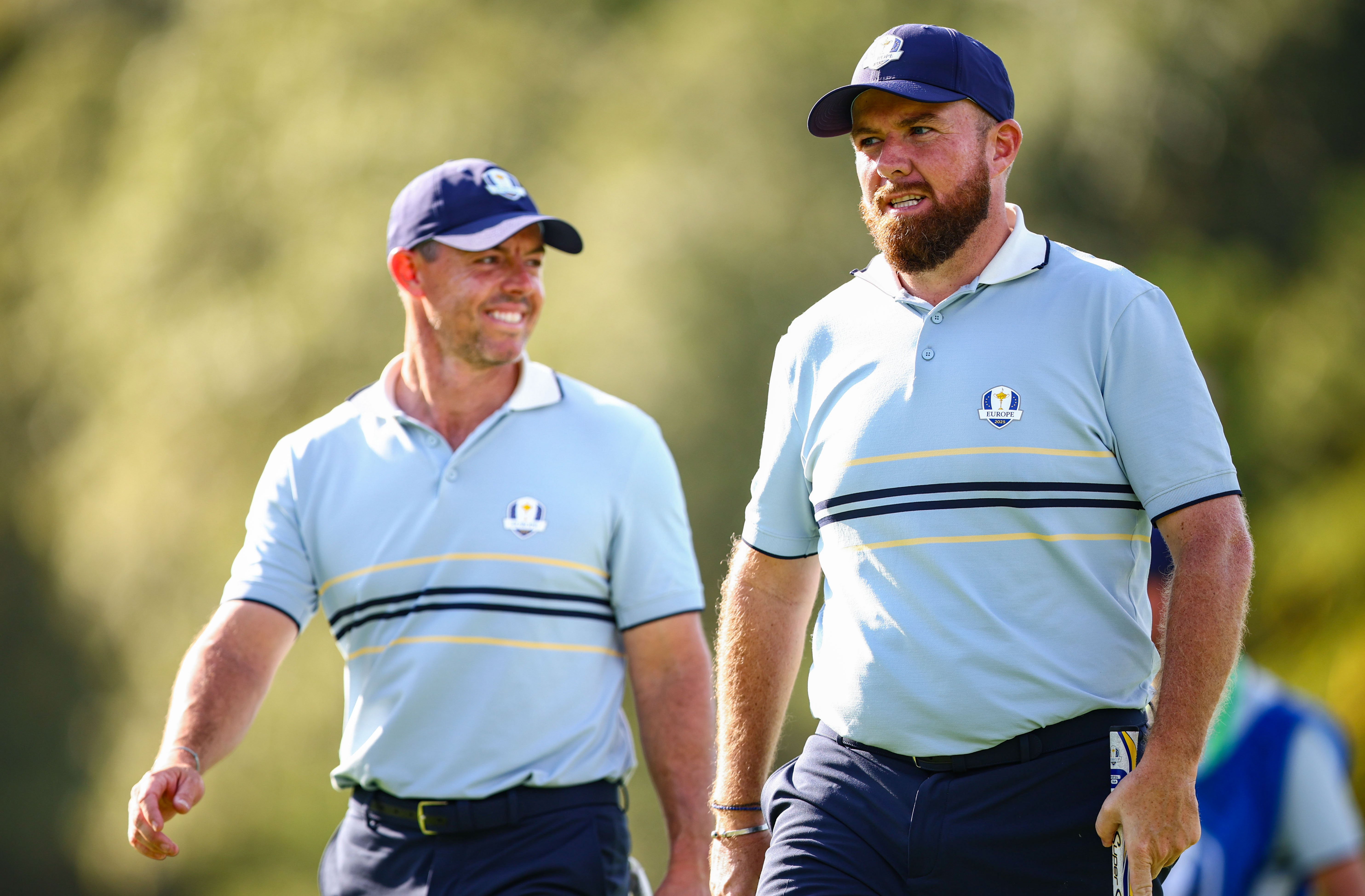 Rory McIlroy and Shane Lowry walk off the green at the Ryder Cup